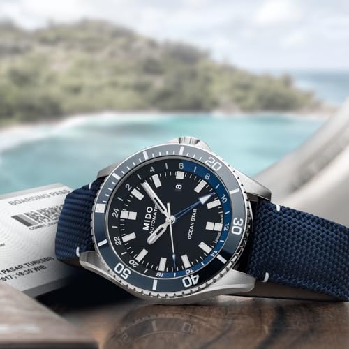 MIDO Ocean Star GMT - Swiss Automatic Watch for Men - 44mm Stainless Steel Case with Black Ceramic Rotating Bezel - Black Dial - Blue Fabric Strap - M0266291705100